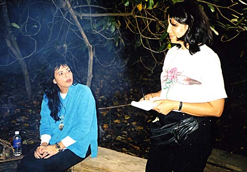 LeAnne Howe [seated] and Ojibwe field Producer Pam Belgarde [standing] on location during the filming of Indian Country Diaries: Spiral of Fire.